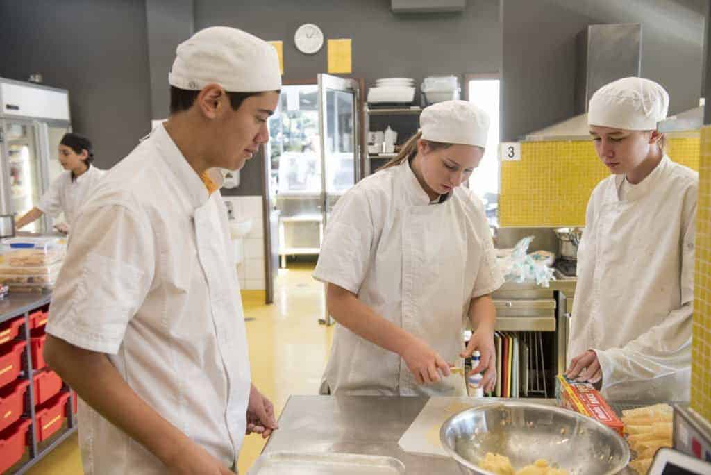 Secondary students participating in food preparation at Caulfield Campus, Caulfield Grammar School