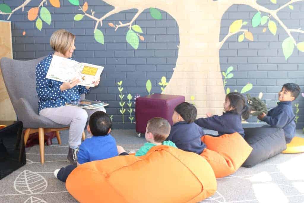 Primary school students reading at Wheelers Hill Campus, Caulfield Grammar School