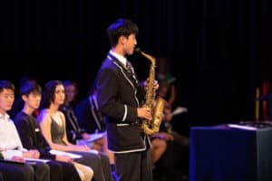 Student Max in Year 11 at Wheelers Hill Campus performing saxaphone