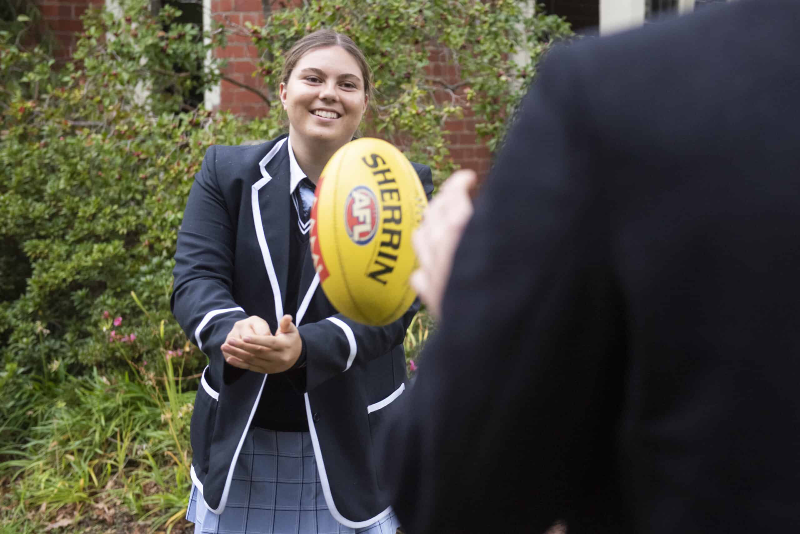 Boarding House Co-Captain Madi with football