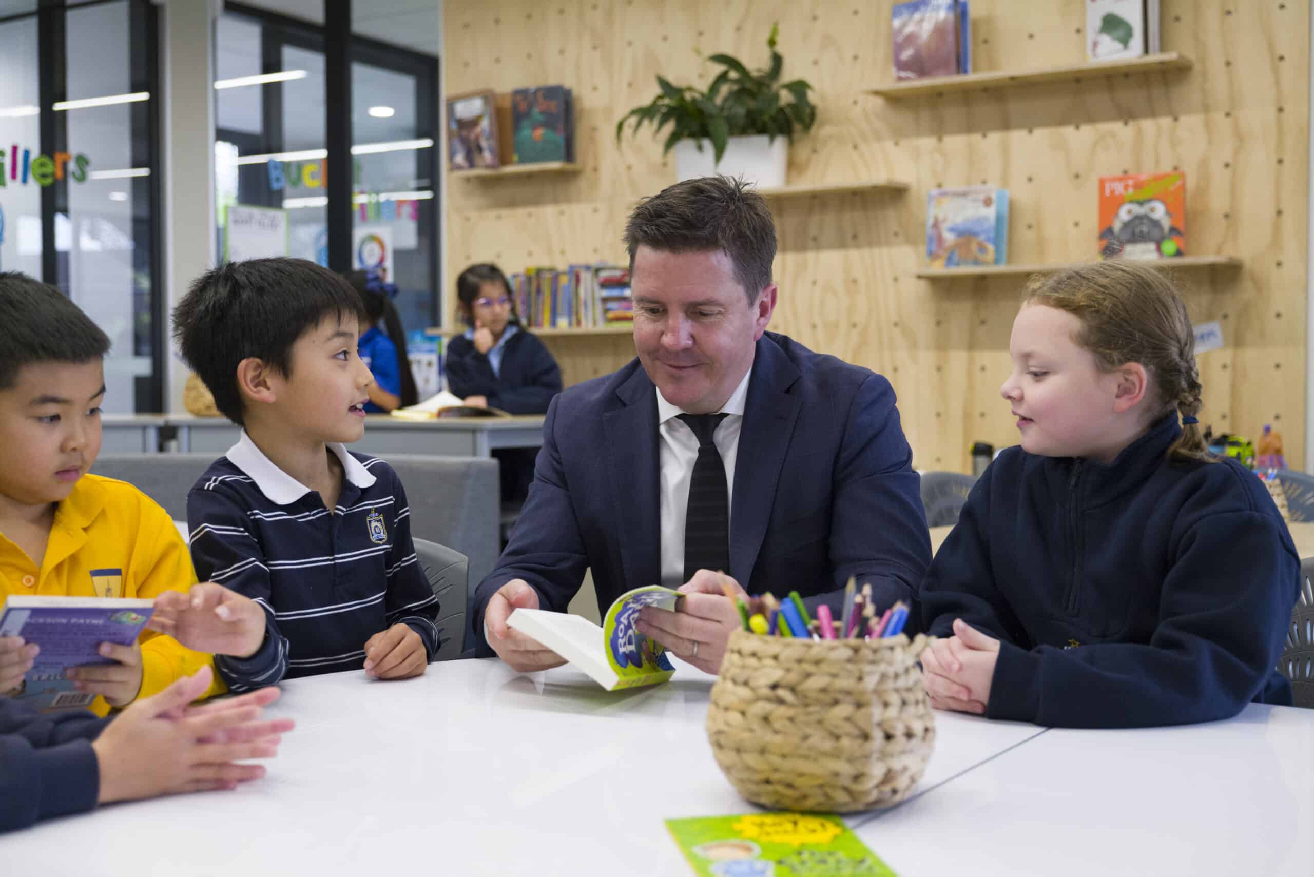 Principal Ashleigh Martin with junior school children