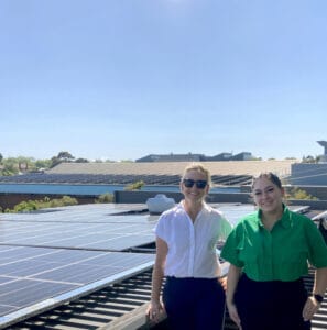 Anna Palaskis (left) and Annabel Jarvis from Caulfield Grammar’s Strategic Infrastructure team view the new Roy Hoult Centre solar panels.
